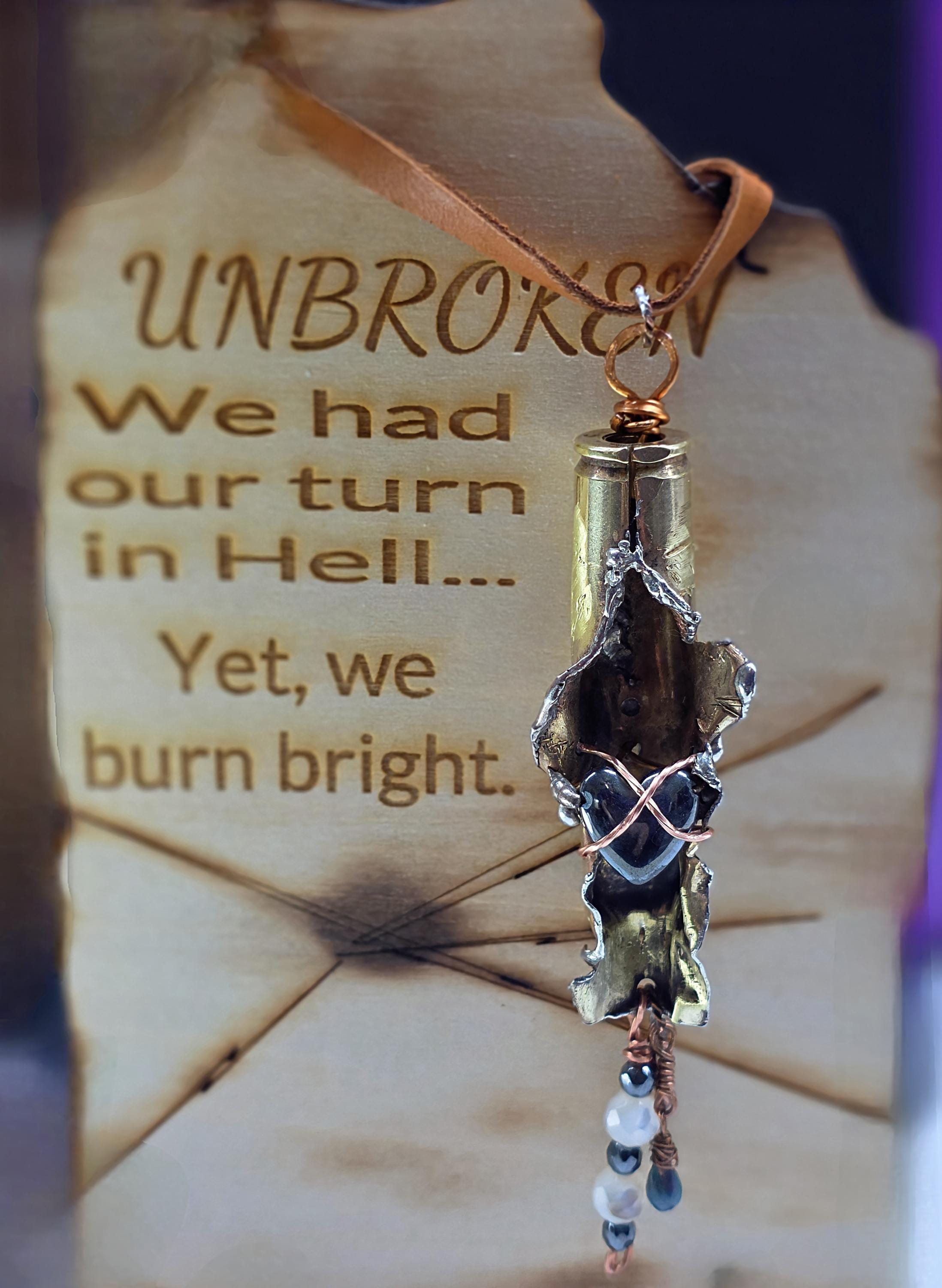 UNBROKEN “Center Mass” Shell Casing Pendant – Hematite Heart Necklace, Raw Metal Talisman, Survivor Jewelry, Rugged Artisan Pendant