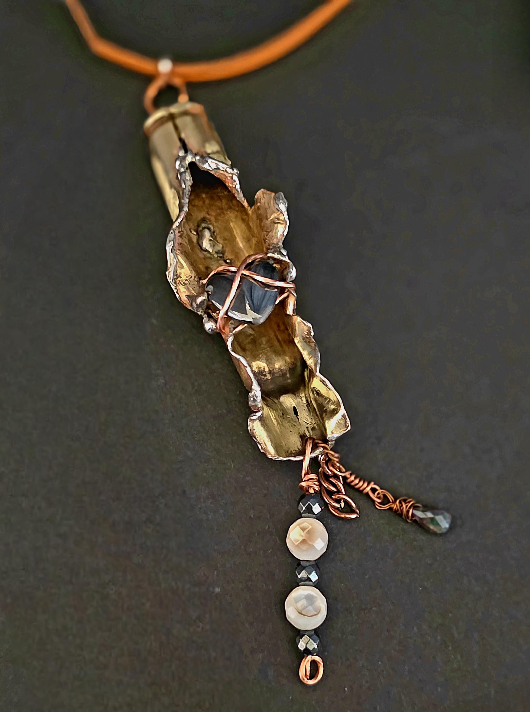 UNBROKEN “Center Mass” Shell Casing Pendant – Hematite Heart Necklace, Raw Metal Talisman, Survivor Jewelry, Rugged Artisan Pendant