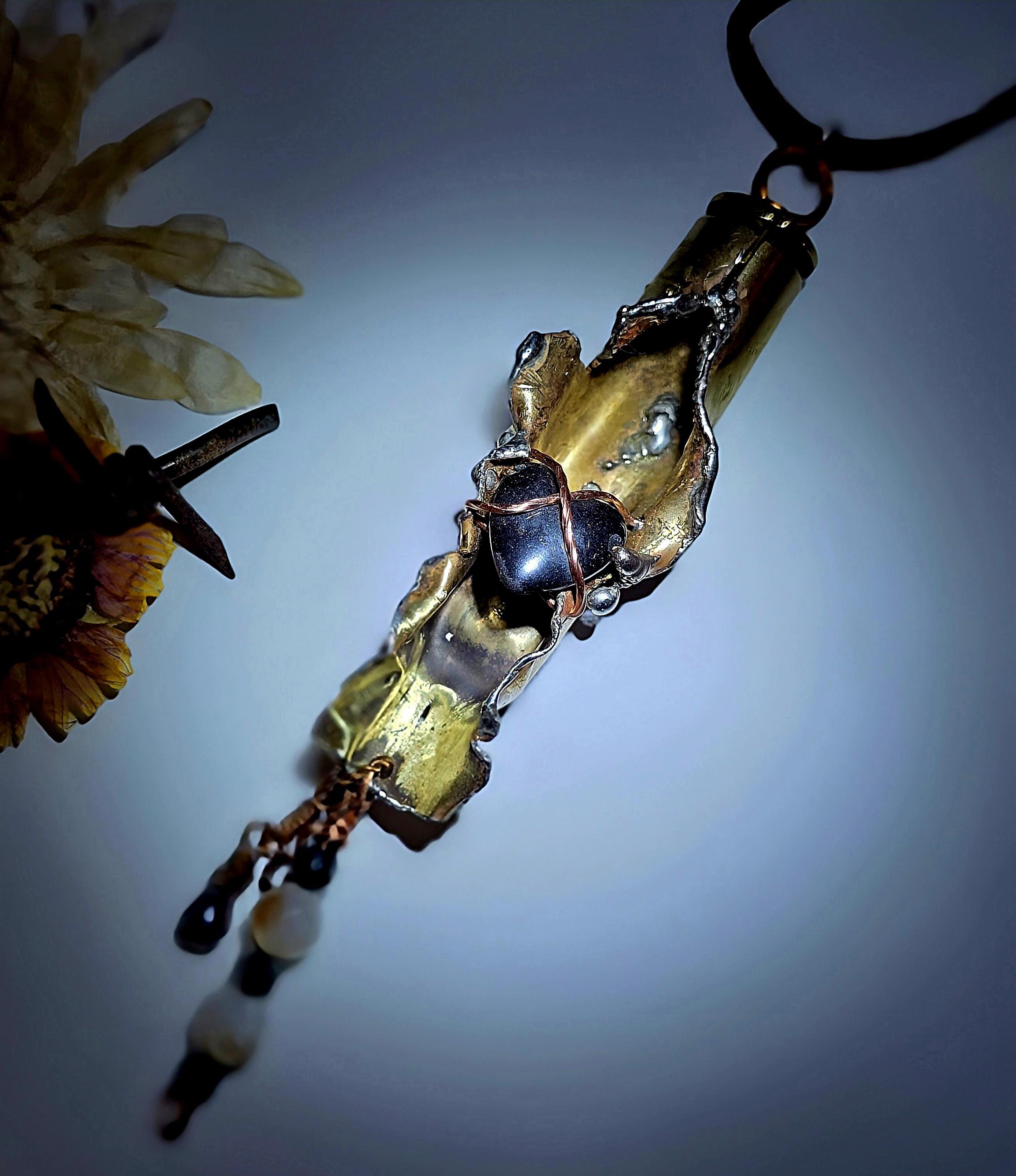 UNBROKEN “Center Mass” Shell Casing Pendant – Hematite Heart Necklace, Raw Metal Talisman, Survivor Jewelry, Rugged Artisan Pendant